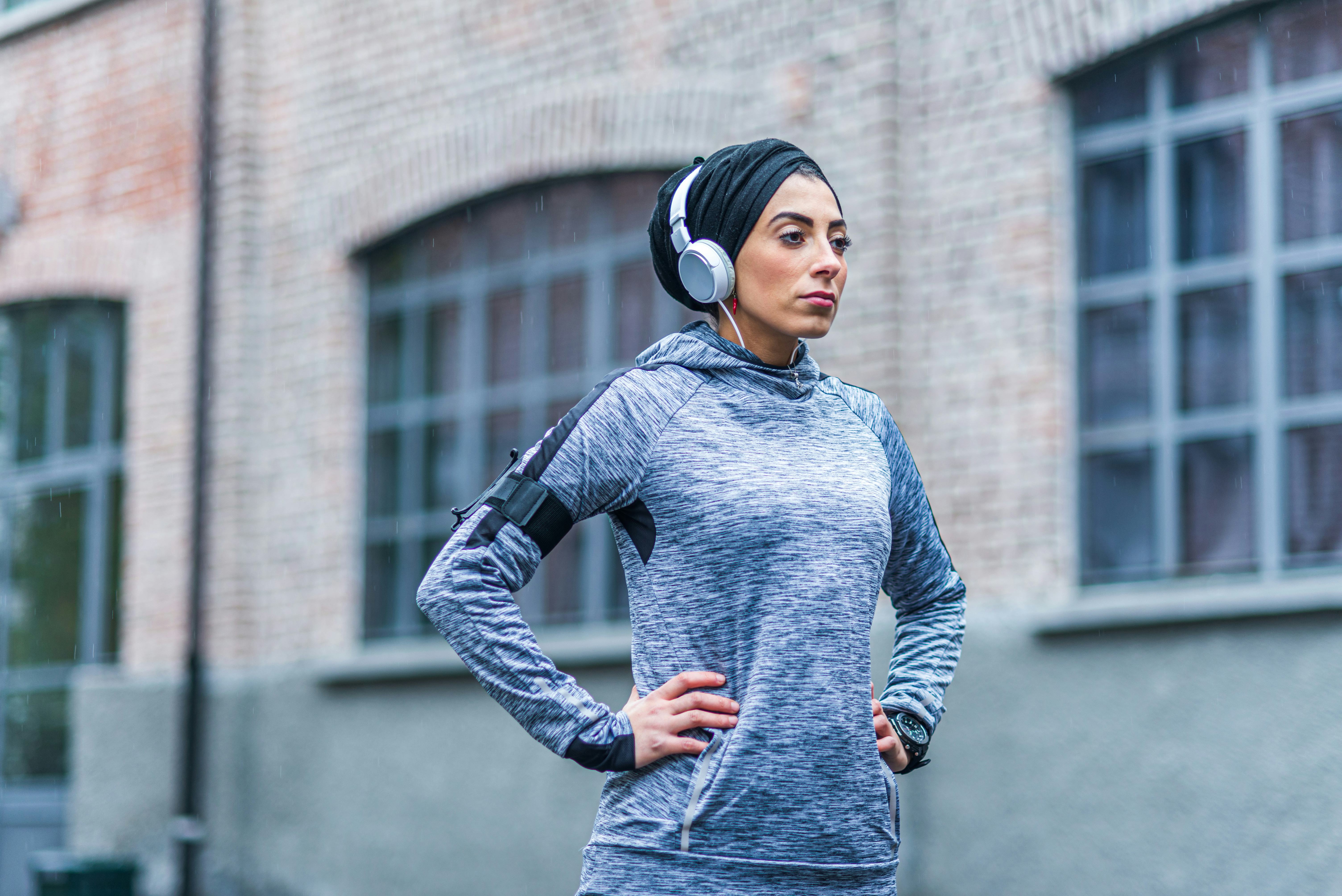 A woman in hijab rests during a run. Strava's 2020 year in sport data shows how much women worked ou...