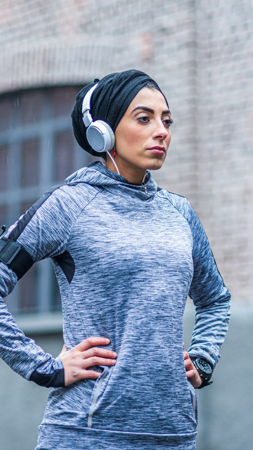 A woman in hijab rests during a run. Strava's 2020 year in sport data shows how much women worked ou...
