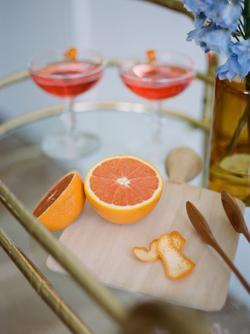 An instagrammable bar cart full of different kinds of liquor. A doctor explains what type of alcohol...