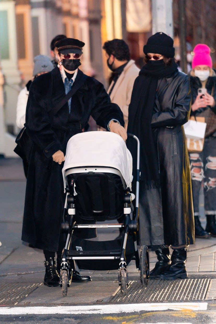 Gigi and Bella Hadid twinned in black duster coats.