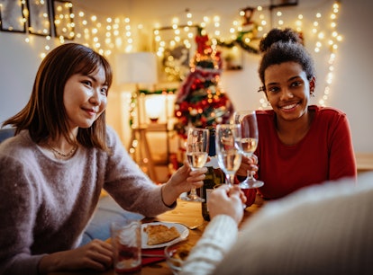 Three friends celebrate the holidays by posting pics with champagne captions for Instagram.