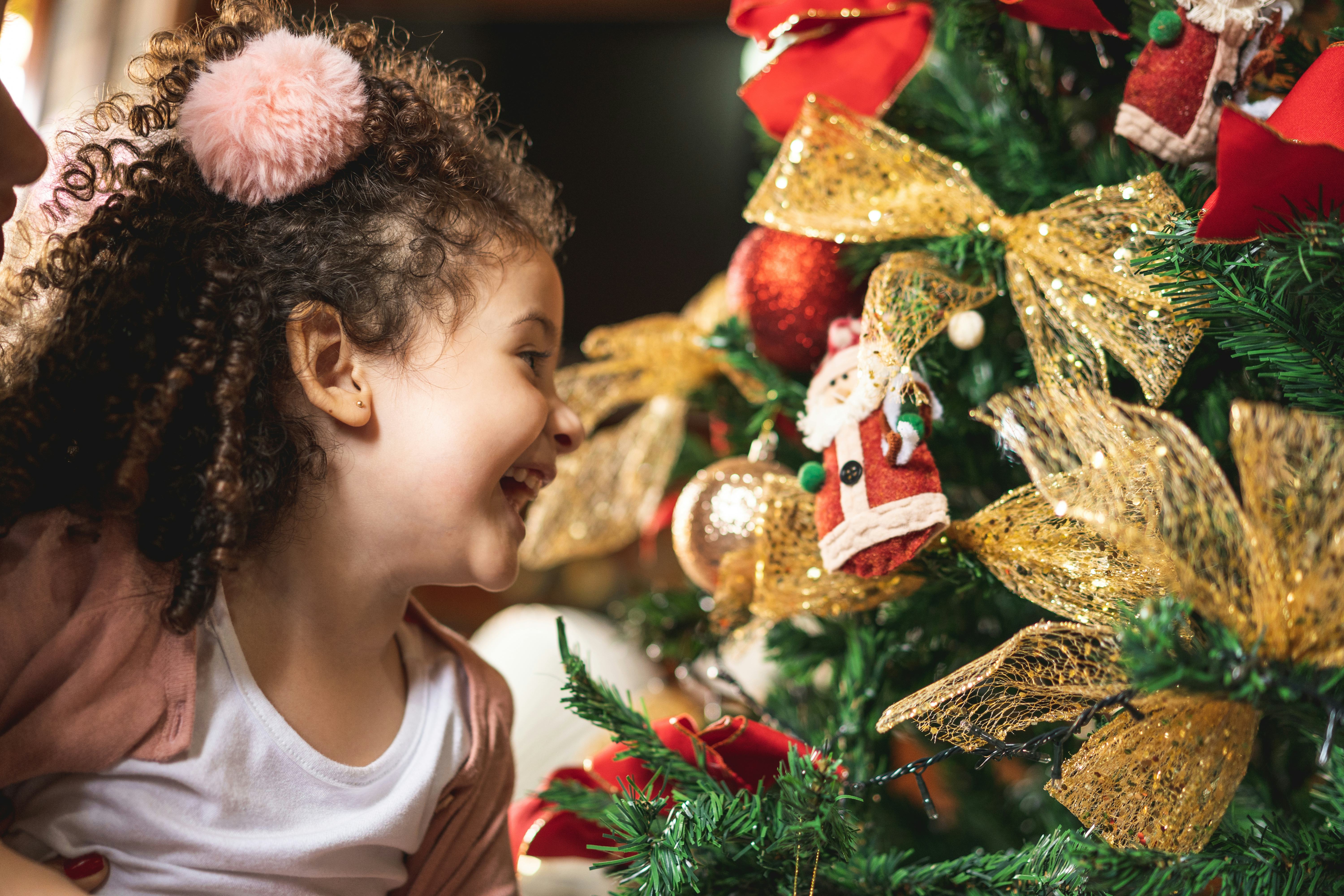 young girl looking at ornaments