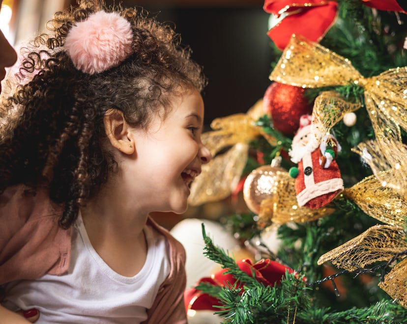 young girl looking at ornaments
