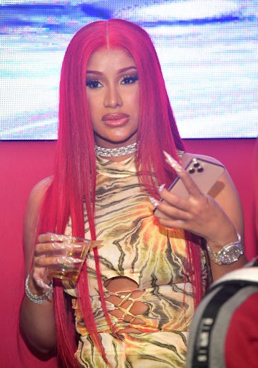 Cardi B rocks bright red hair.