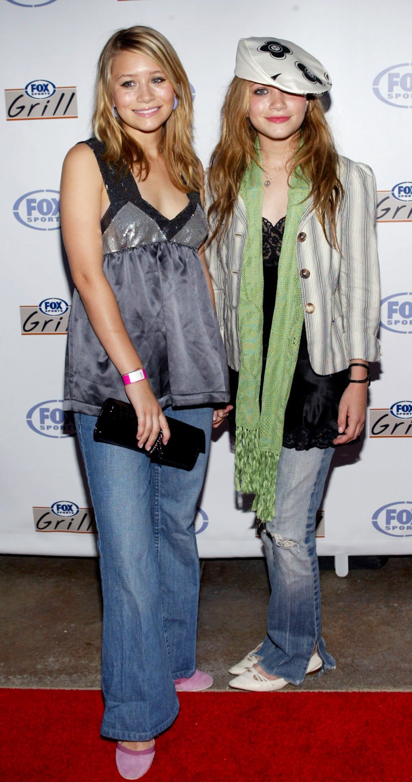 Actors Mary-Kate and Ashley Olsen attend the grand opening of the Fox Sports Grill at the Irvine Spe...