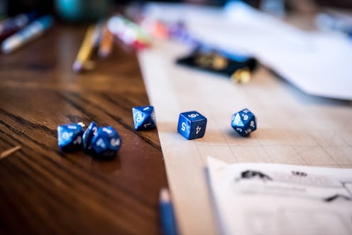 Various multi-sided dice in a dungeons and dragons game. How to play dungeons & dragons on zoom onli...