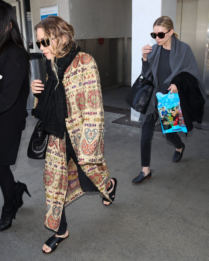 Mary Kate Olsen and Ashley Olsen seen at LAX on May 07, 2014 in Los Angeles, California. 