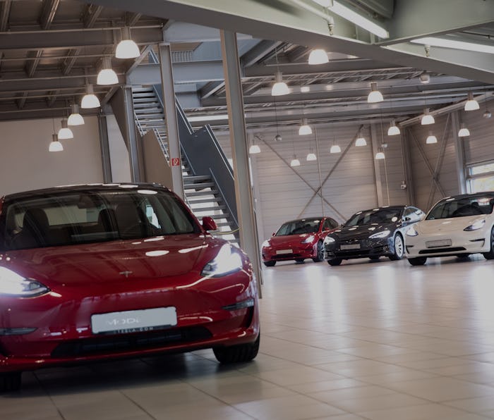 Tesla Model 3 on a showroom floor.