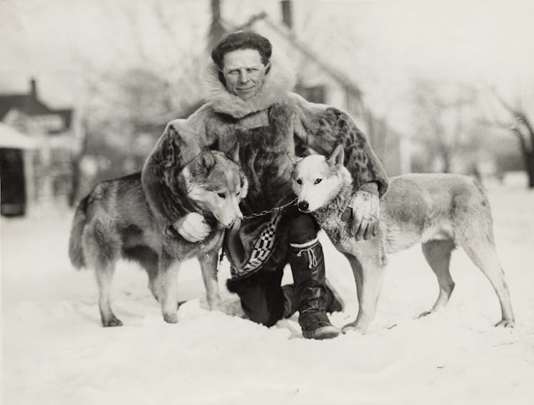 Dog musher Leonard Seppala, of Nome, Alaska with two of his dogs