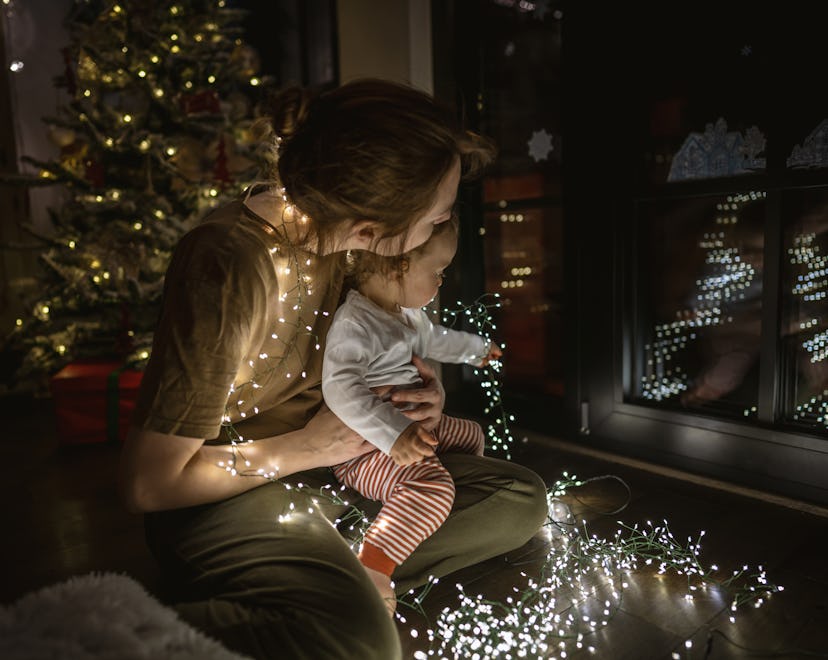 baby looking at christmas lights