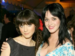 Katy Perry and Zooey Deschanel, who look shockingly similar, pose for a photo at a party.