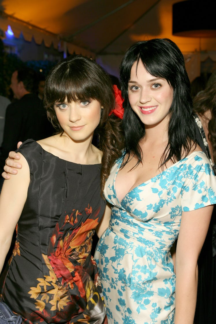 Katy Perry and Zooey Deschanel, who look shockingly similar, pose for a photo at a party.