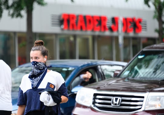 woman outside of trader joe's 