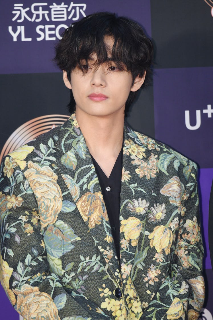 BTS' V hits the red carpet in a floral blazer.