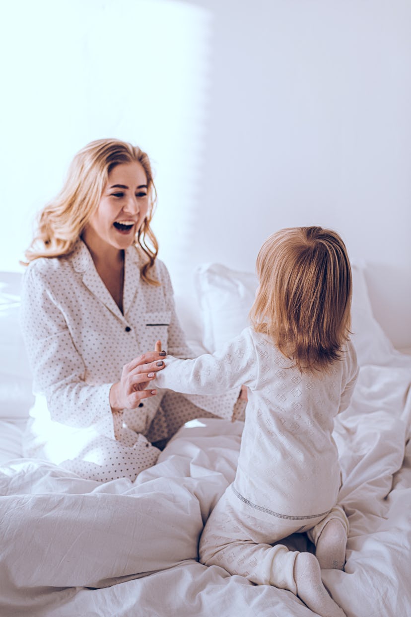 A mother and a daughter playing as a part of the work from home morning routine 