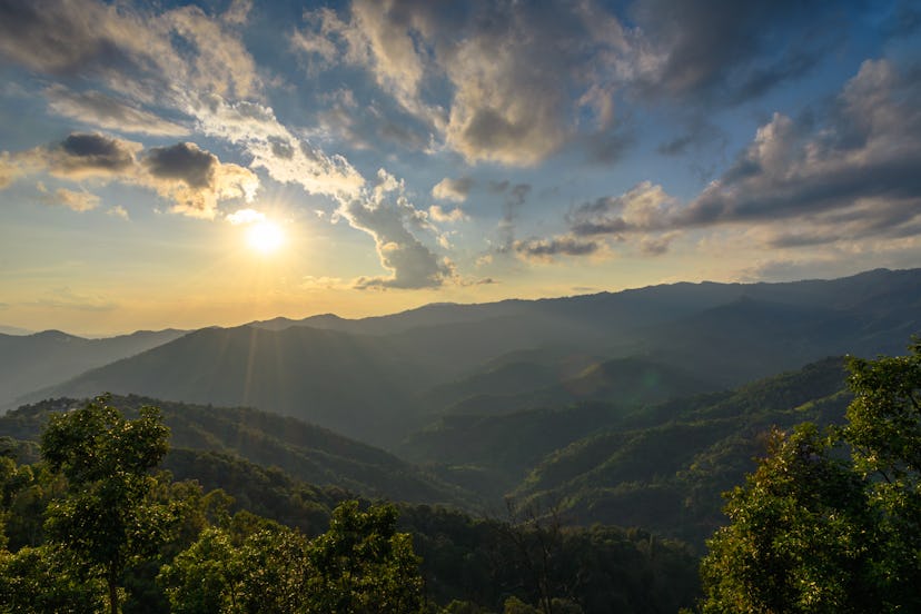 Sunset over green hills.