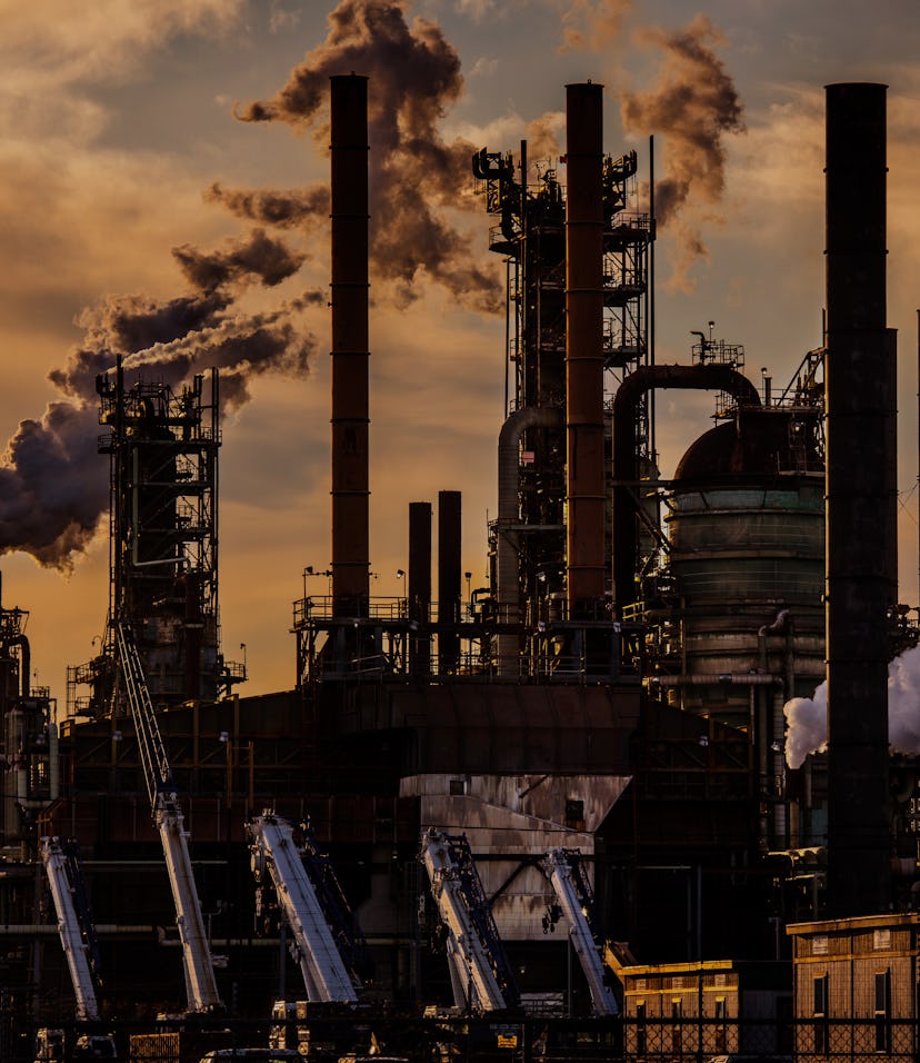 Smoke billows out of an Exxon factory.