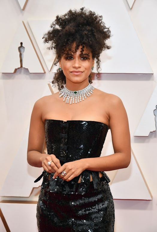 Zazie Beetz’s hairstyle at the 2020 Oscars with dress and jewelry.