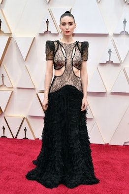 Rooney Mara posing in a black Alexander McQueen gown