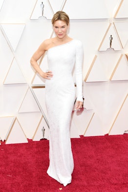 Renée Zellweger posing in a white Armani gown