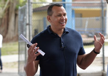 Alex Rodriguez flashes a smile for cameras.