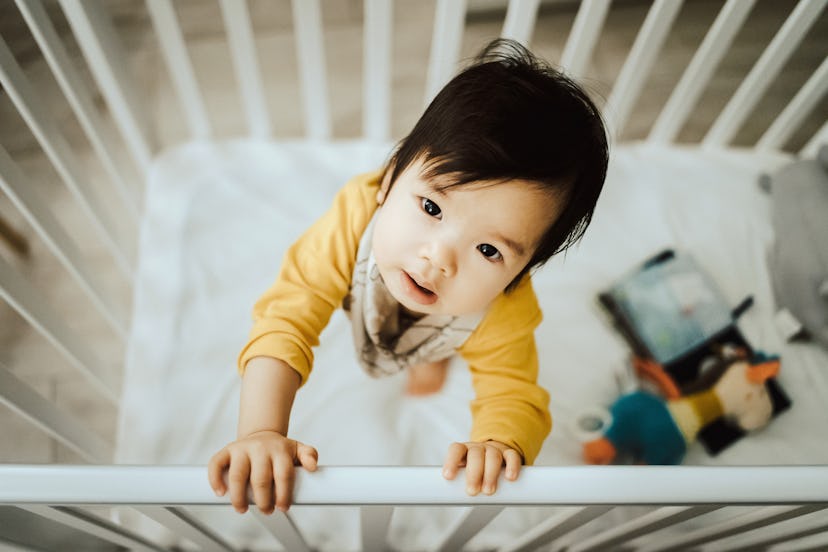 Removing toys and pillows is one way to keep your toddler from climbing out of a crib.