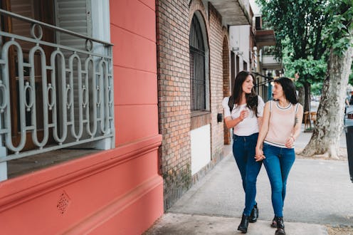Two girls walking down a street and talking about dating red flags