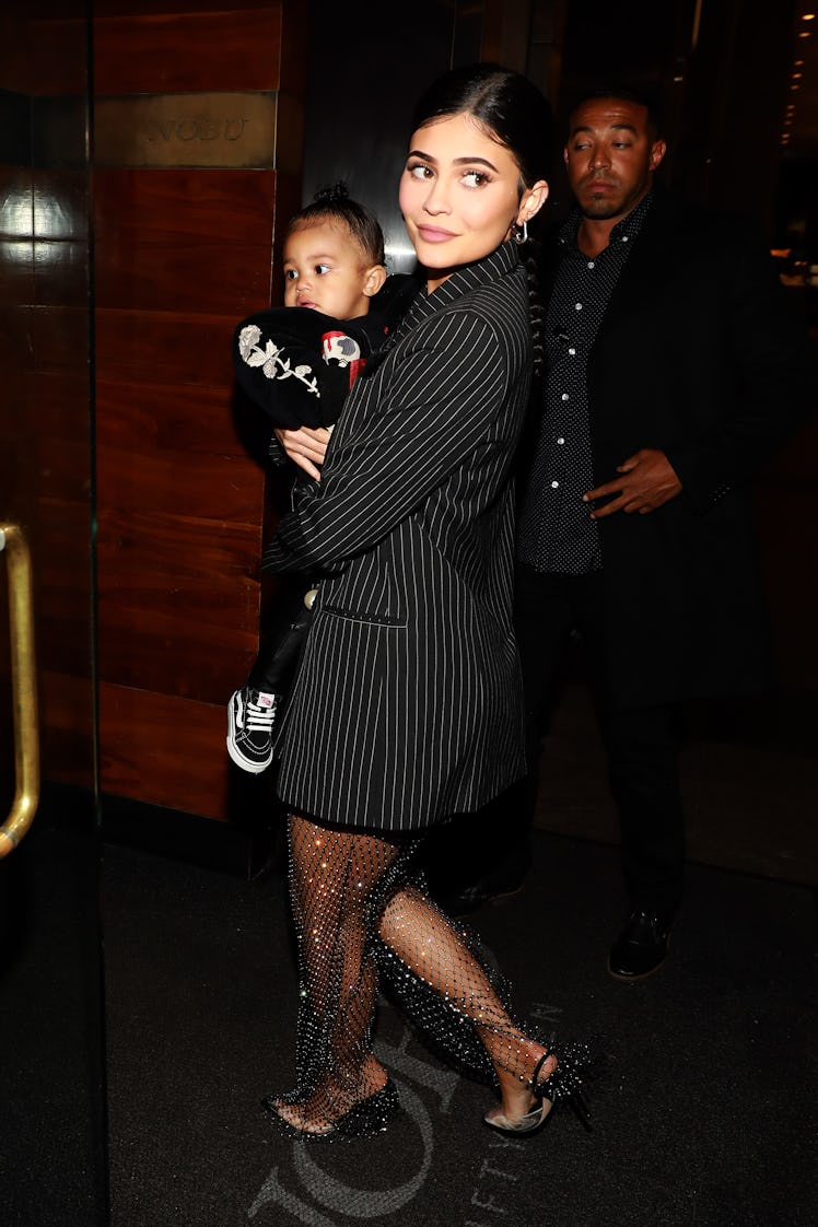 Kylie Jenner steps out with her daughter Stormi.