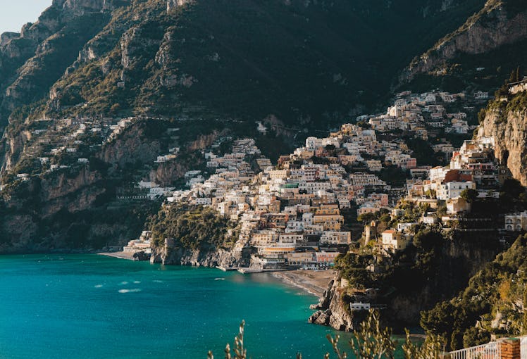 Positano, Italy and its colorful architecture are tucked into the Italian coastline. 