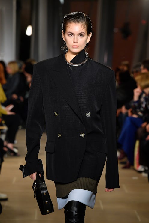 A model walking the runway in a look featuring an element of asymmetric styling from Proenza Schoule...