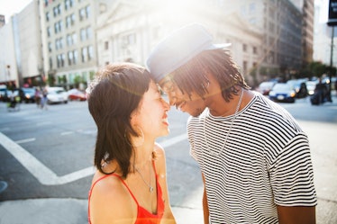 A young couple shares a romantic moment on the streets of Los Angeles.