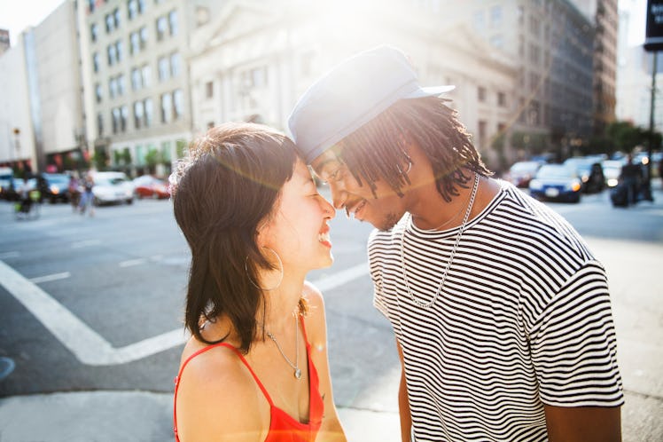 A young couple shares a romantic moment on the streets of Los Angeles.