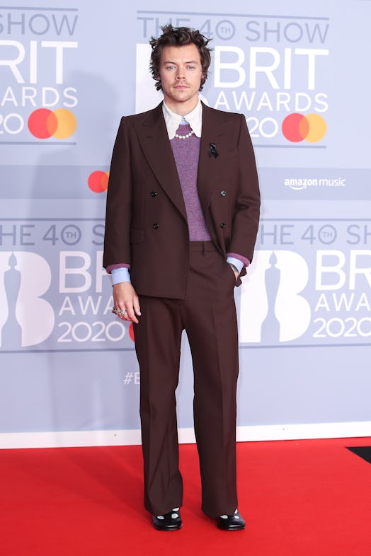 Harry Styles' 2020 Brit Awards look featured bedhead and pearls. 