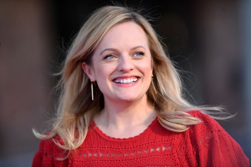 Elisabeth Moss' orange eyeshadow and black dress at 'The Invisible Man' photocall.