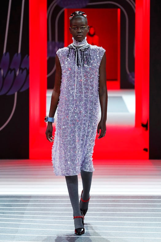 A model walking the Prada Fall 2020 runway in a bedazzled sheer dress 