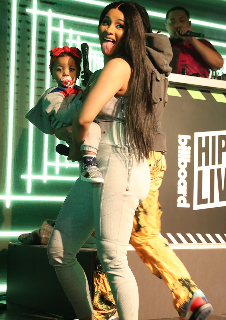 Cardi B dances onstage with her daughter Kulture.