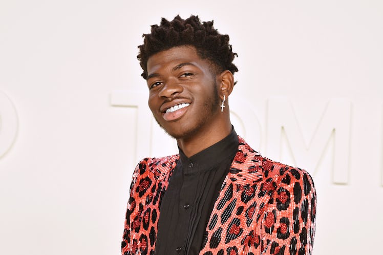 Lil Nas X rocks a cheetah print blazer.