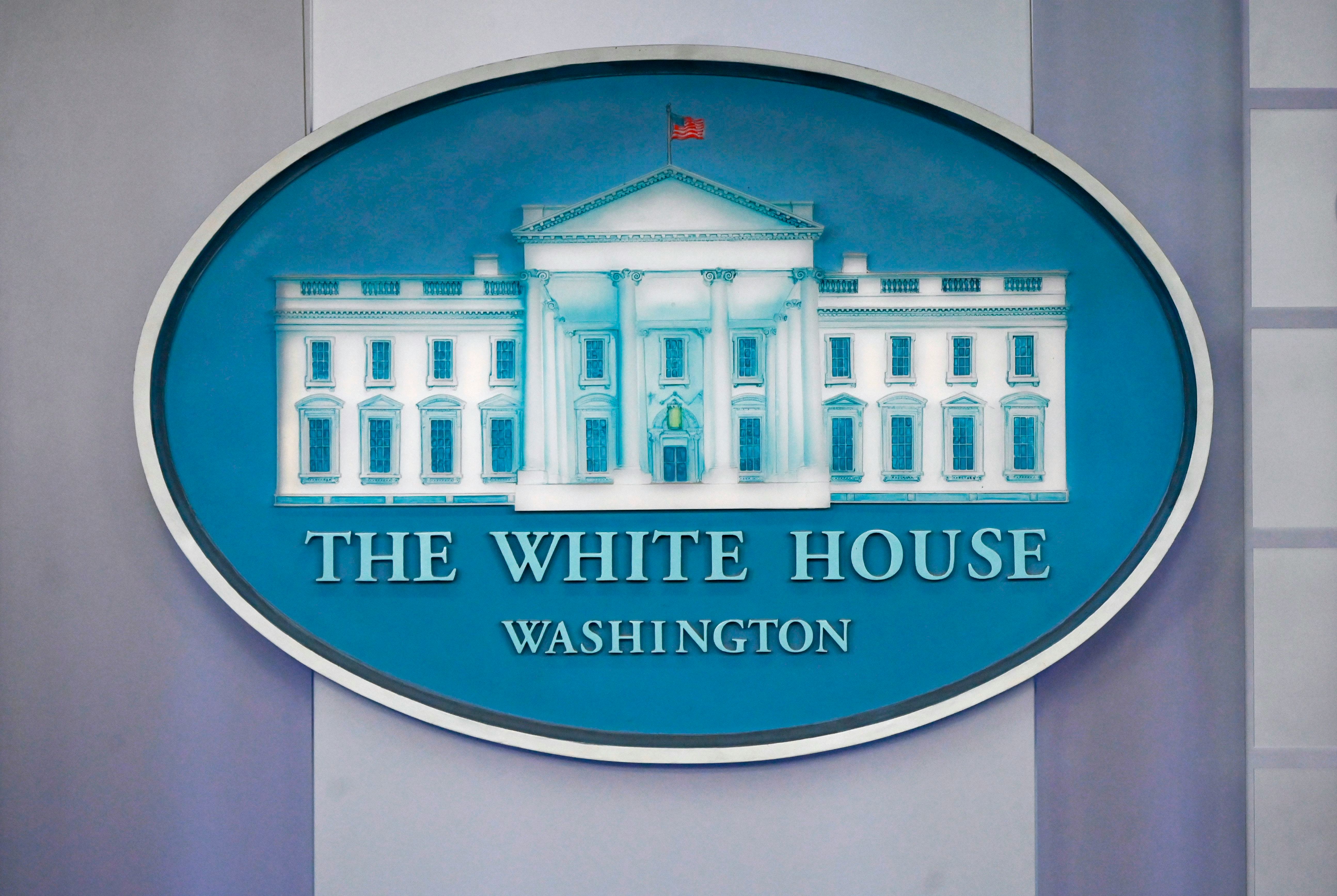 The White House logo is displayed in the press briefing room of the White House in Washington, D.C. ...