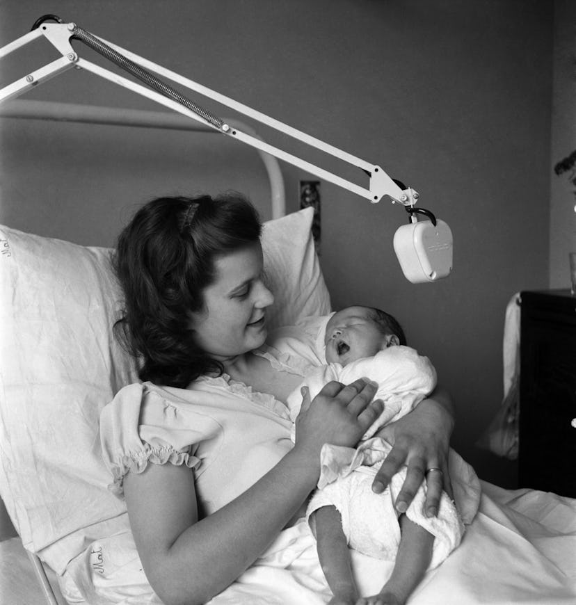 This 1940s photo of a mom and her new baby is almost ethereal, it's so soft and lovely.