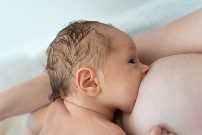 how to pamper your breastfeeding boobs, white mom breastfeeding her baby in a bathtub