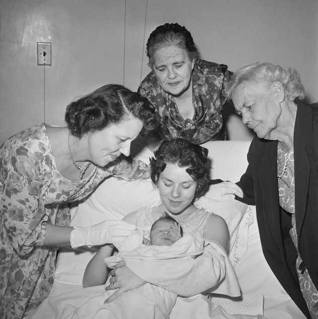 This vintage photo of a mom with her newborn baby shows five beautiful generations of their family. 