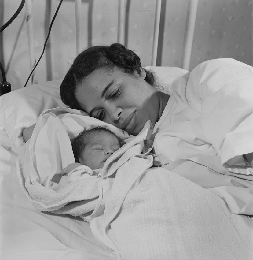 This 1945 photo of a mother nestled into her newborn baby is just lovely.