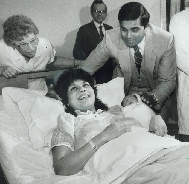 This 1984 photo of the first "test tube" baby shows pure joy on the mother's face in her hospital be...