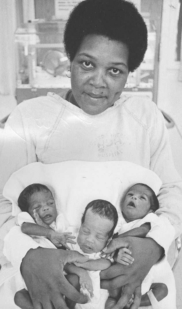 This 1968 mom gets a chance to hold all three of her tiny babies in the hospital.