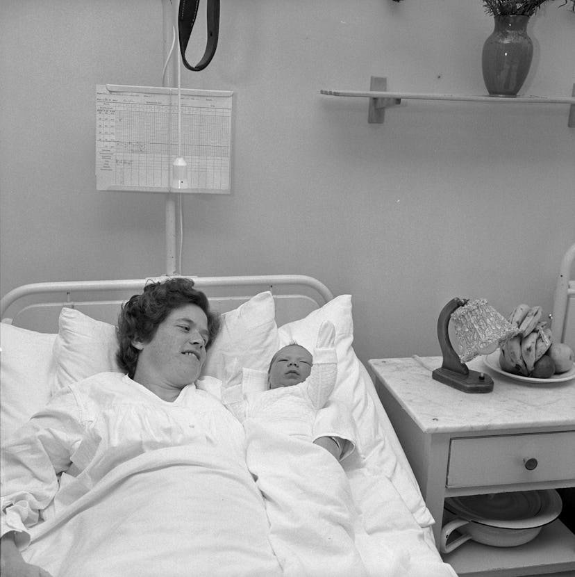 This 1961 maternity ward photo of a mom and her new baby is so lovely, and also proves how much hosp...