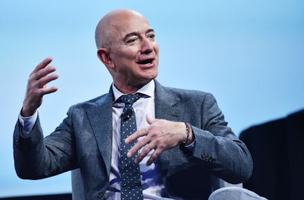 Jeff Bezos speaking in a suit and tie