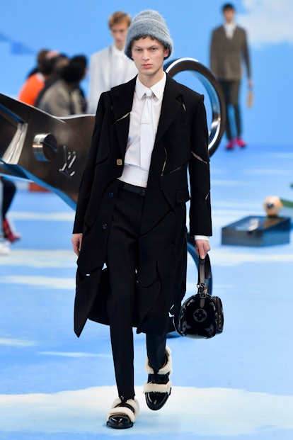 A model walking the runway of Louis Vuitton Men Fall/Winter 2020 fashion show