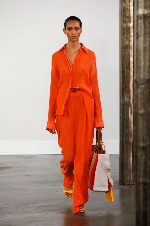 A model wearing an orange flowy suit from Gabriela Hearst's Spring/Summer 2020 collection