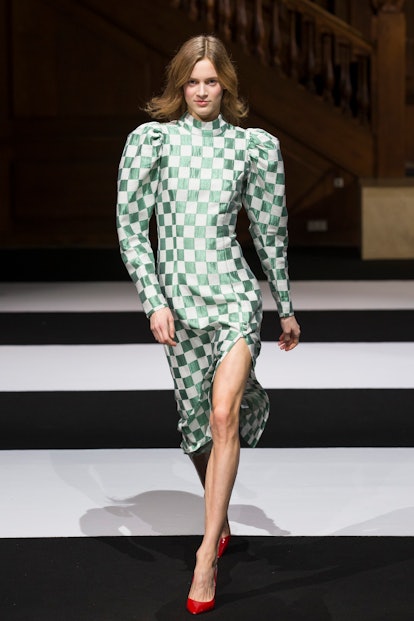 Model wears ROTATE's mint-and-white, green checkered dress at Copenhagen Fashion Week