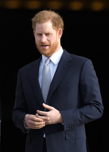 Prince Harry smiling nervously while twisting his wedding ring around his finger